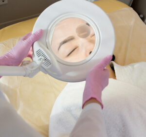 cosmetologist-using-magnifying-lamp-FVCNW6E.jpg